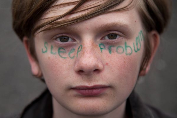 Young person with sleep problem written across his face