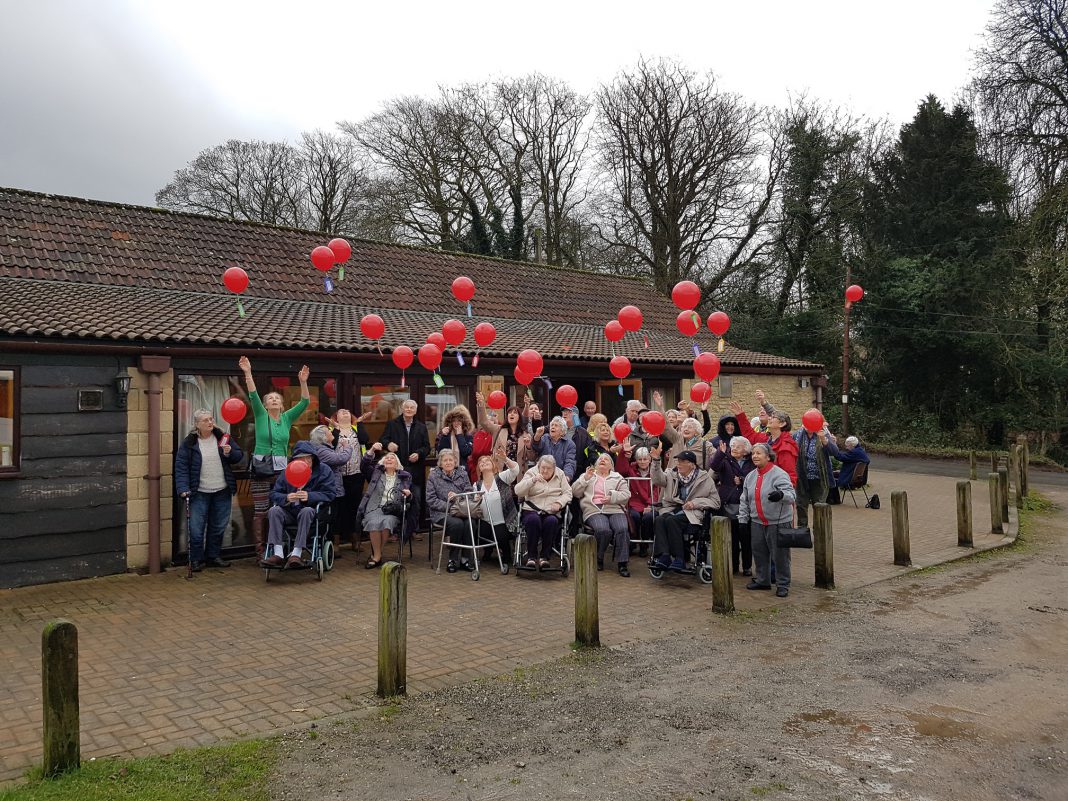 Service users at Cambrian Green Day Services celebrating their dignity in care day