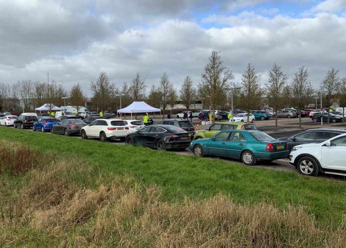 Vehicles queuing for community surge testing for Covid-19 variant in Emersons Green