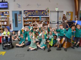 Pupils from Emerson’s Green Primary School with Children’s author Emma Perry at Emerson’s Green Library, to mark the Summer Reading Challenge.