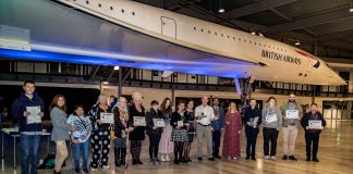 Community Learning award winners gather at an event at Bristol Aerospace Museum