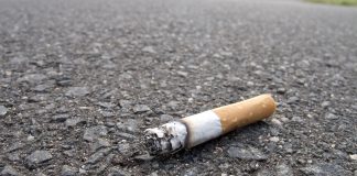 An image of a cigarette end in the road