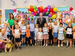 Chair of the Council, Councillor Mike Drew joins a group of children and Summer Reading Challenge volunteers at Emersons Green Library to celebrate everyone who took part in this year’s Summer Reading Challenge.