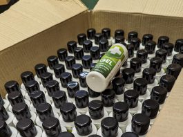 A box filled with bottles of seized fake hand sanitiser