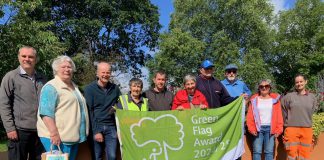 Members of the Friends of Page Park group and South Gloucestershire Council grounds maintenance team gather to celebrate the Green Flag Award.