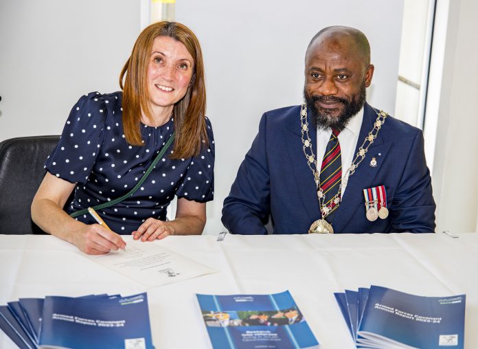 Councillor Alison Evans and Chair of South Gloucestershire Council Councillor Franklin Owusu-Antwi signing the Armed Forces Covenant