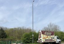 A banner van parked on the roadside