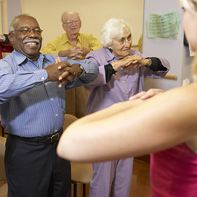 Senior adults in an exercise class watching instructor
