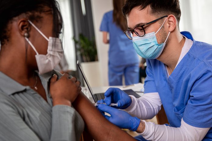 A Covid-19 vacination being administered