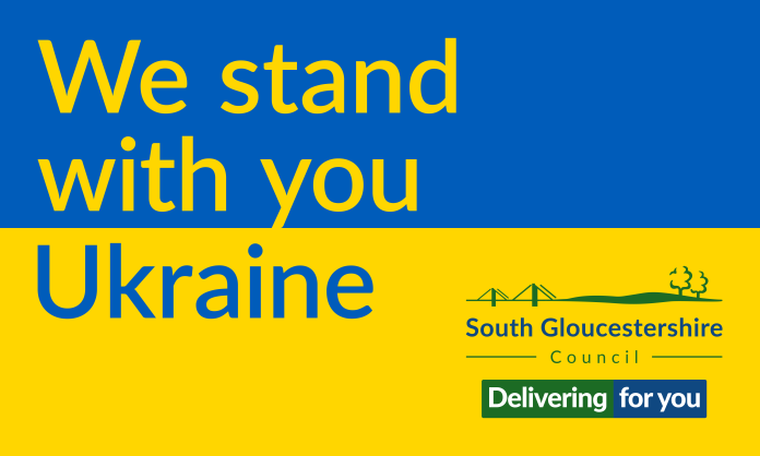 The colours of the Ukrainian flag with the wording We stand with you Ukraine