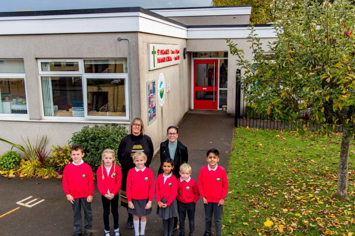 Councillor Erica Williams with the headteacher and pupils of St Michael's CofE Primary School in Winterbourne