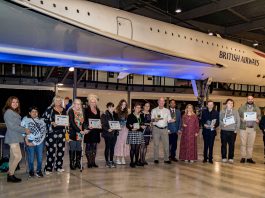 Community Learning award winners gather at an event at Bristol Aerospace Museum