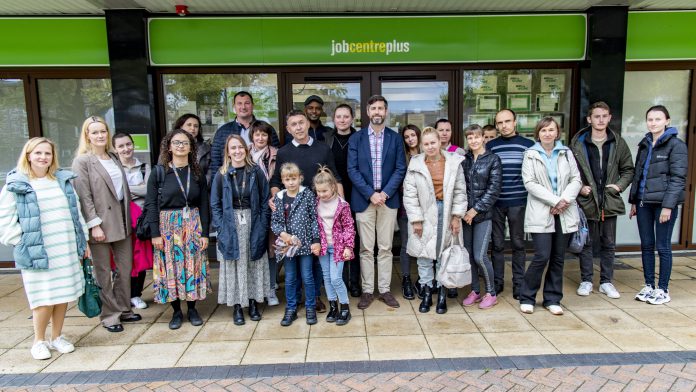 Leader of South Gloucestershire Council, councillor Toby Savage (centre front) with Ukrainian guests and staff involved in the employability workshops at Yate Job Centre Plus.