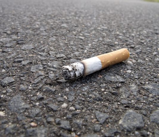 An image of a cigarette end in the road