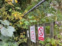 A fenced off path with no entry signs