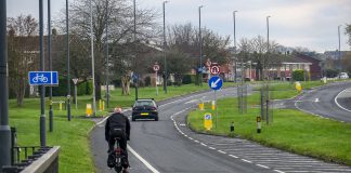 A cyclist travels on a cycle path
