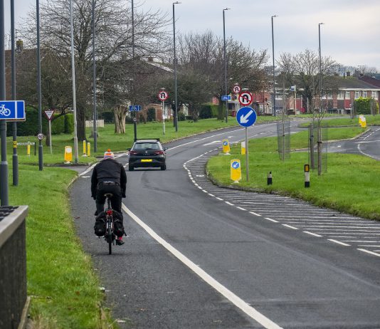 A cyclist travels on a cycle path