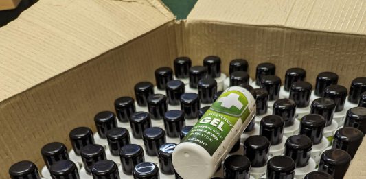A box filled with bottles of seized fake hand sanitiser