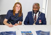 Councillor Alison Evans and Chair of South Gloucestershire Council Councillor Franklin Owusu-Antwi signing the Armed Forces Covenant