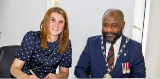 Councillor Alison Evans and Chair of South Gloucestershire Council Councillor Franklin Owusu-Antwi signing the Armed Forces Covenant