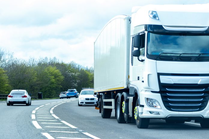 Traffic on a road including a lorry