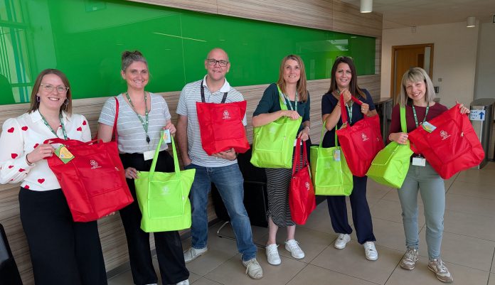Councillor Alison Evans and council staff who helped put together the packs