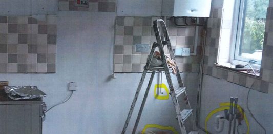 An empty kitchen after Brown ripped out the units