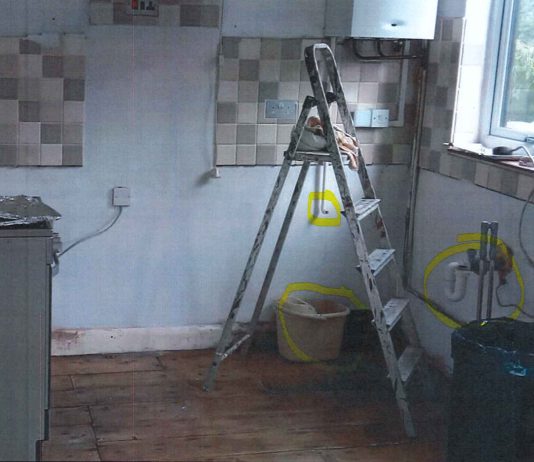 An empty kitchen after Brown ripped out the units