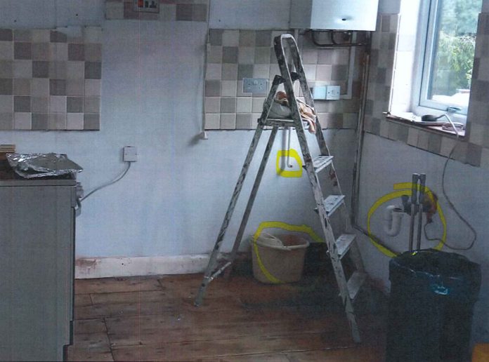 An empty kitchen after Brown ripped out the units