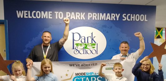 Children and staff from The Park Primary School in Kingswood celebrate their Modeshift STARS accreditation.