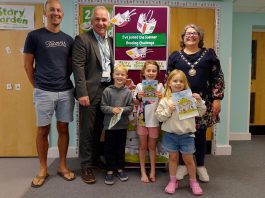 Chair of South Gloucestershire Council, councillor Katie Cooper (right) and Cabinet Member with responsibility for Libraries, councillor Sean Rhodes (second from left), are pictured with local children and a parent at Yate Library to celebrate the launch of the 2025 Summer Reading Challenge.