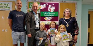 Chair of South Gloucestershire Council, councillor Katie Cooper (right) and Cabinet Member with responsibility for Libraries, councillor Sean Rhodes (second from left), are pictured with local children and a parent at Yate Library to celebrate the launch of the 2025 Summer Reading Challenge.