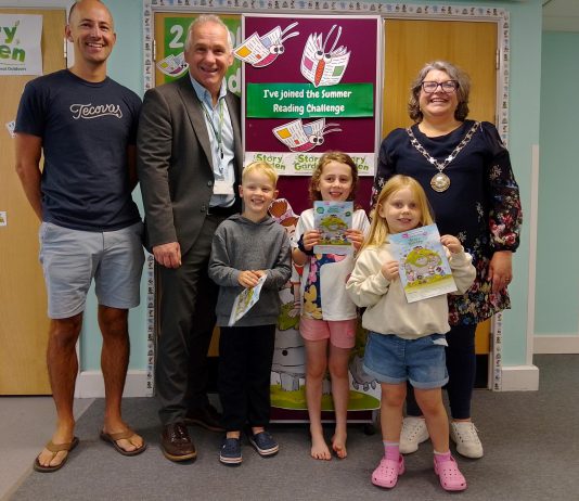 Chair of South Gloucestershire Council, councillor Katie Cooper (right) and Cabinet Member with responsibility for Libraries, councillor Sean Rhodes (second from left), are pictured with local children and a parent at Yate Library to celebrate the launch of the 2025 Summer Reading Challenge.