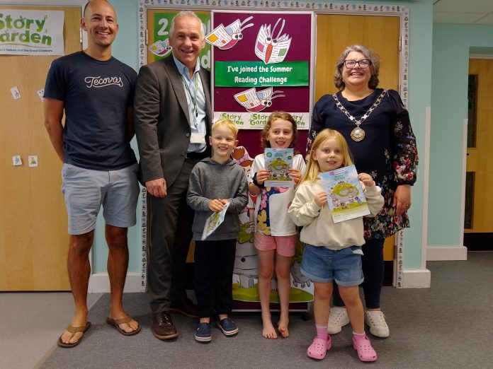 Chair of South Gloucestershire Council, councillor Katie Cooper (right) and Cabinet Member with responsibility for Libraries, councillor Sean Rhodes (second from left), are pictured with local children and a parent at Yate Library to celebrate the launch of the 2025 Summer Reading Challenge.