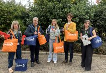 Councillor Alison Evans, cabinet member for cost of living, equalities and public health, Councillor Tony Williams, lead partner member for cost of living, equalities and public health, and some of the staff that helped put together the warm packs