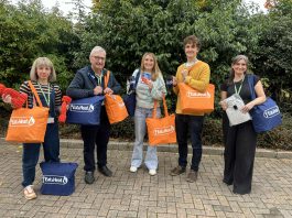 Councillor Alison Evans, cabinet member for cost of living, equalities and public health, Councillor Tony Williams, lead partner member for cost of living, equalities and public health, and some of the staff that helped put together the warm packs