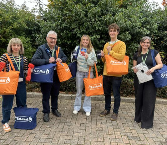Councillor Alison Evans, cabinet member for cost of living, equalities and public health, Councillor Tony Williams, lead partner member for cost of living, equalities and public health, and some of the staff that helped put together the warm packs