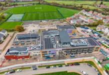 The attached image shows an aerial view of the schools, with the exterior construction now complete.