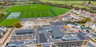 The attached image shows an aerial view of the schools, with the exterior construction now complete.