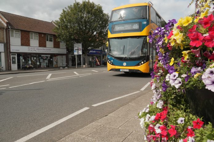 A bus travelling down Downend Road/Downend High STreet