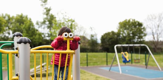 a small child at a play area