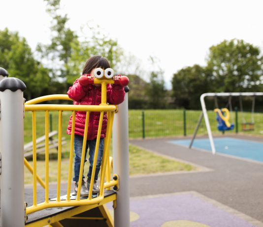a small child at a play area