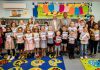 Chair of South Gloucestershire Council, councillor Adrian Rush (Back row, centre left) and Cabinet Member with responsibility for Libraries, councillor John Bradbury (Back row, centre right), are pictured with local children who participated in the Challenge, along with volunteers, at Hanham Library.