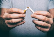 male hand snapping cigarette